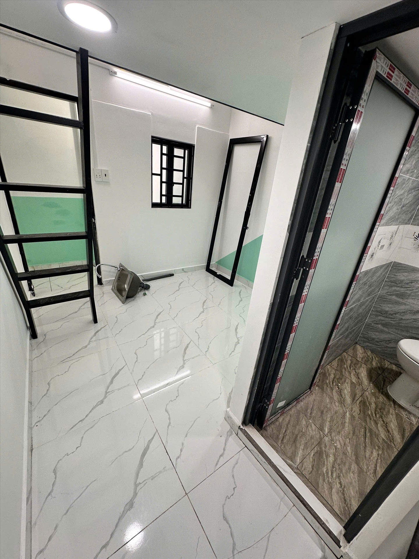 Phòng trọ 1 Phòng ngủ 20m2 tại CQ Home Bùi Đình Túy - Bình Thạnh - Phòng khách